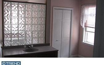 master bath with walk in closet and whirlpool tub