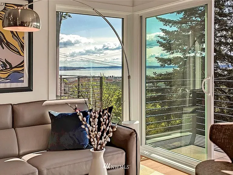 Wall of windows, private deck, and beautiful water views.