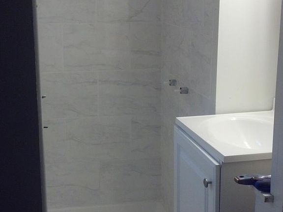 1st floor bathroom -newly remodeled in white marble