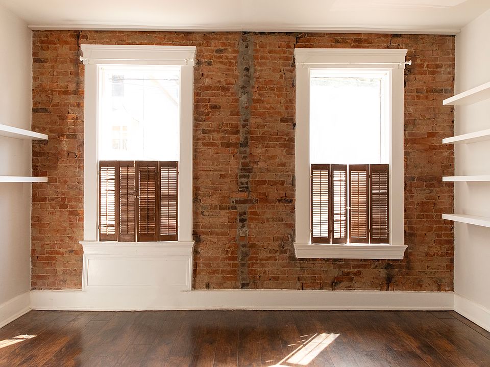 Living room/bedroom facing the front (Winkler street). Floating shelves offer unique design and plenty of book/ plant storage