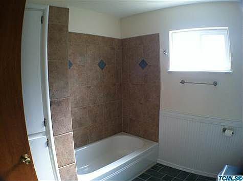 New Tile surround in hall bath.