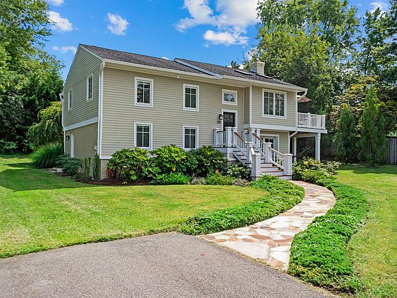 Front exterior with large driveway