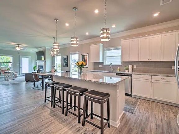 Eat in bar at 8 foot island. Luxury vinyl flooring throughout!