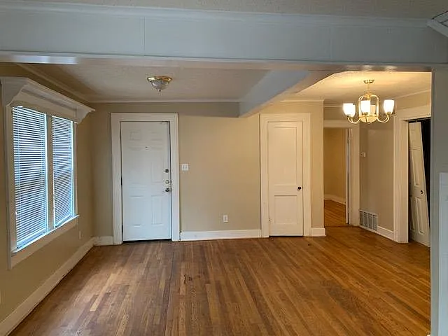 Den also has an eating area. The exterior door goes to the front porch
