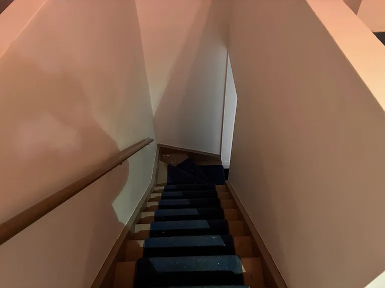 Stairs leading up to the third story.