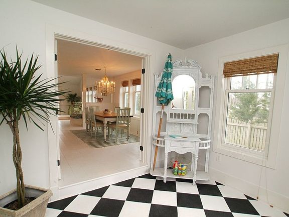 Entrance to Cottage with black & white painted concrete. 