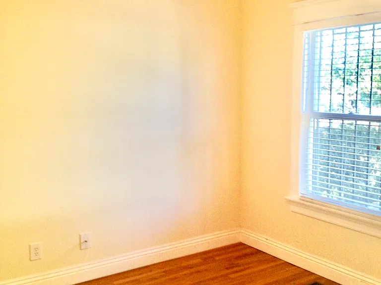 Private bedroom with hardwood floors and natural light near USC Village - ideal for graduate scholars