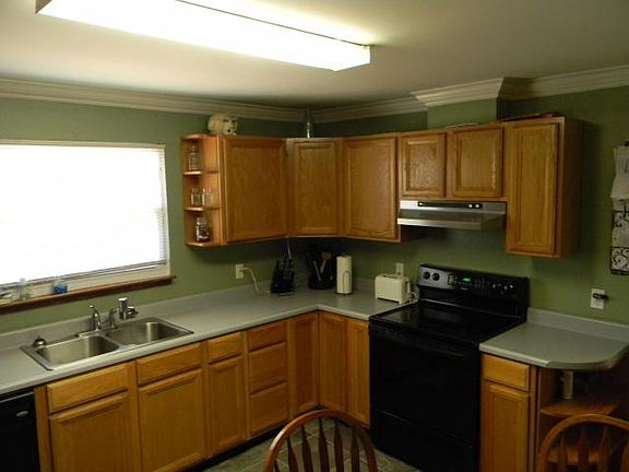 Kitchen overlooks backyard