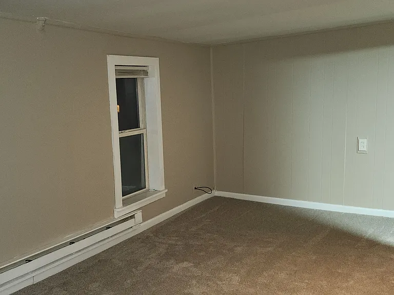 Large living room with fresh carpet