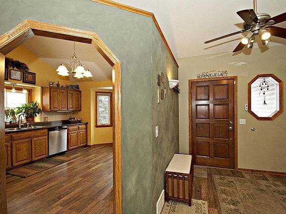 large beautiful fenced in yard with big deck and patio