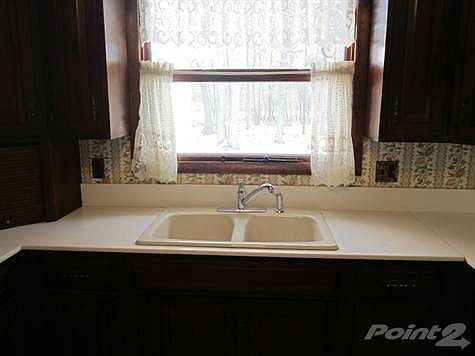 Sink overlooking the wooded backyard!
