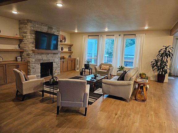 Great room with gas fireplace and plenty shelf space and covered storage, soft close covers.