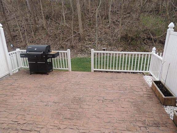 Patio extends into yard and woodline