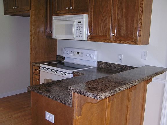 Kitchen wood floors, wood cabnets, Dish washer, Stove/stove top, Microwave