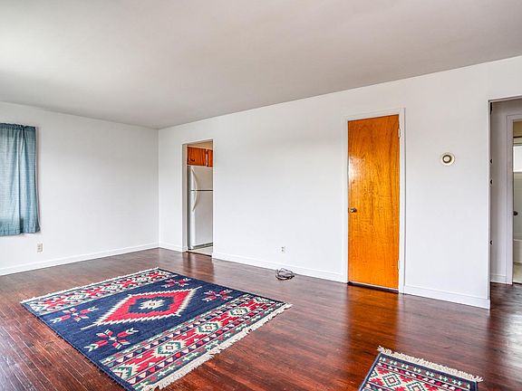 View from entryway with front hall closet and kitchen access
