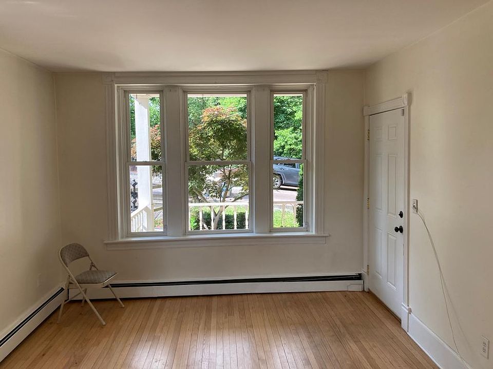 Entrance in the house and window looking out front from the living room