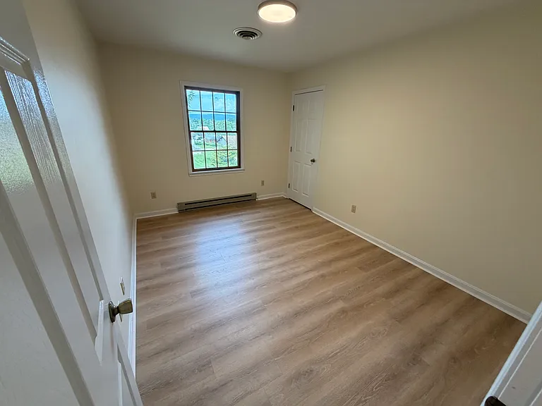 3rd bedroom showcases brand new flooring.