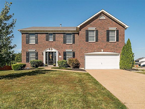 Stately Brick Elevation with Keystone Accents, Decorative Molding frames the front door. Large Corner Lot that is fenced and Level.