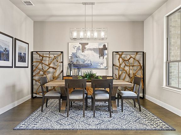 REPRESENTATIVE PHOTO - Dining room in the Plaza home plan by Trophy Signature Homes