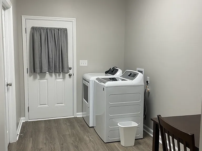 Laundry room , from kitchen looking towards back door