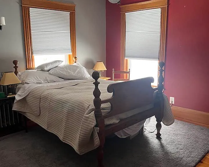 Southeast bedroom has a deep closet and a full size bed, and lots of sunshine!