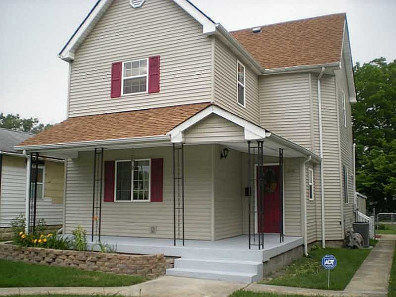 Exterior Front. New siding, windows, gutters and down spouts