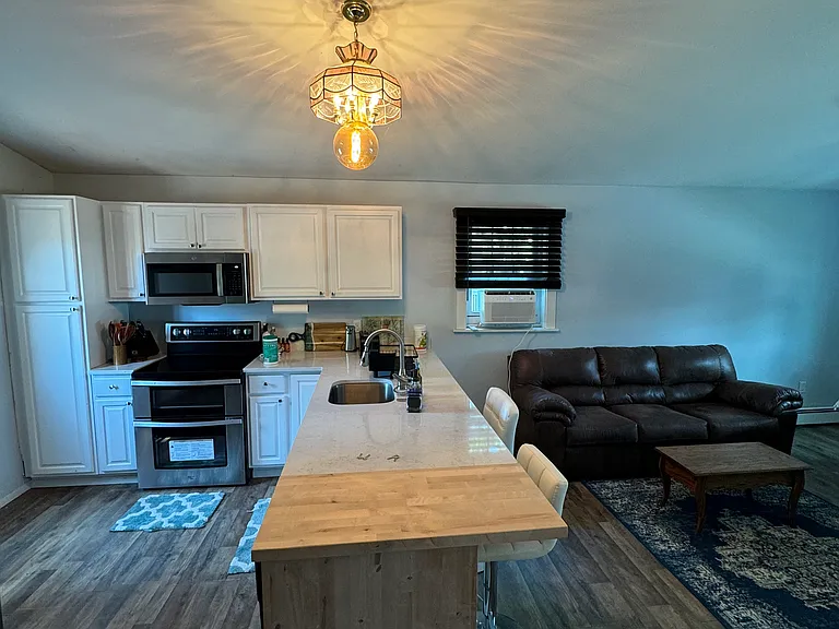 Kitchen and living room different view.