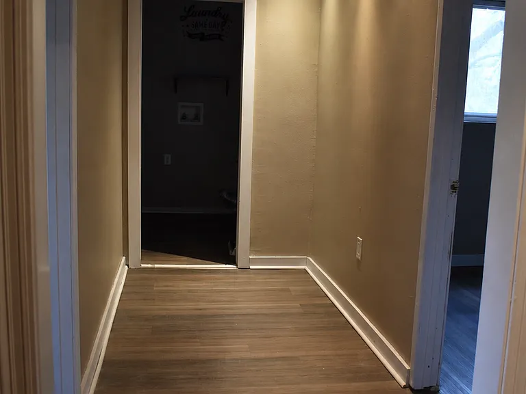 interior with modern flooring and recessed lighting throughout.