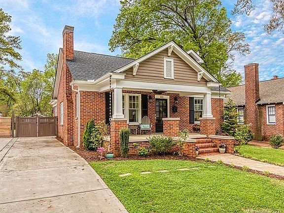 New concrete driveway with electronic gate.