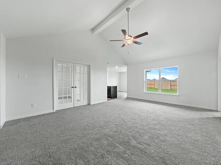 The family room of the Sabine has a large window with great natural light and back yard views.