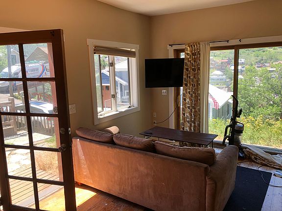 Entrance to apartment. Living room. Sliding door to patio.