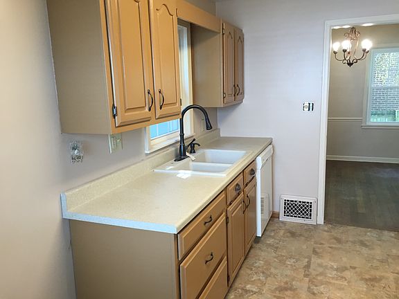 Renovated kitchen cabinets, new tops, new plumbing and light