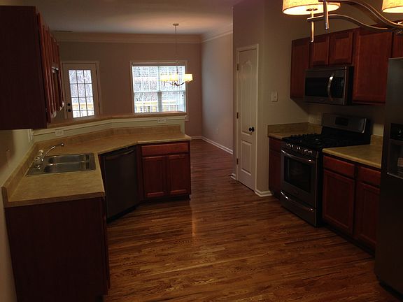 from dinnette area looking through kitchen to living room