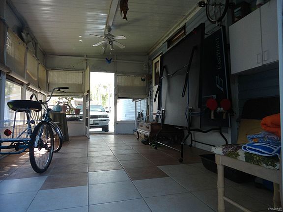 LANAI USED AS GAME ROOM