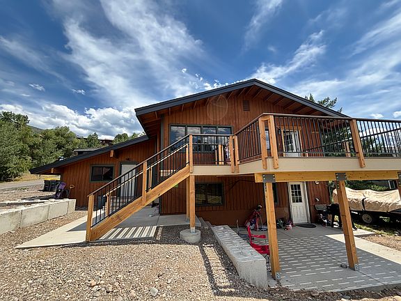 House with new deck for upstairs unit.