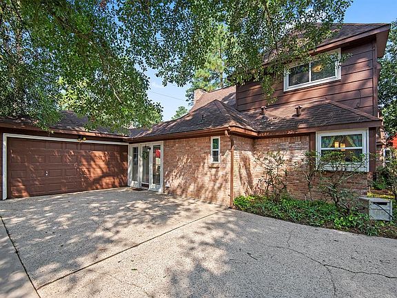 The extra wide driveway offers plenty of parking - and notice the replaced windows.