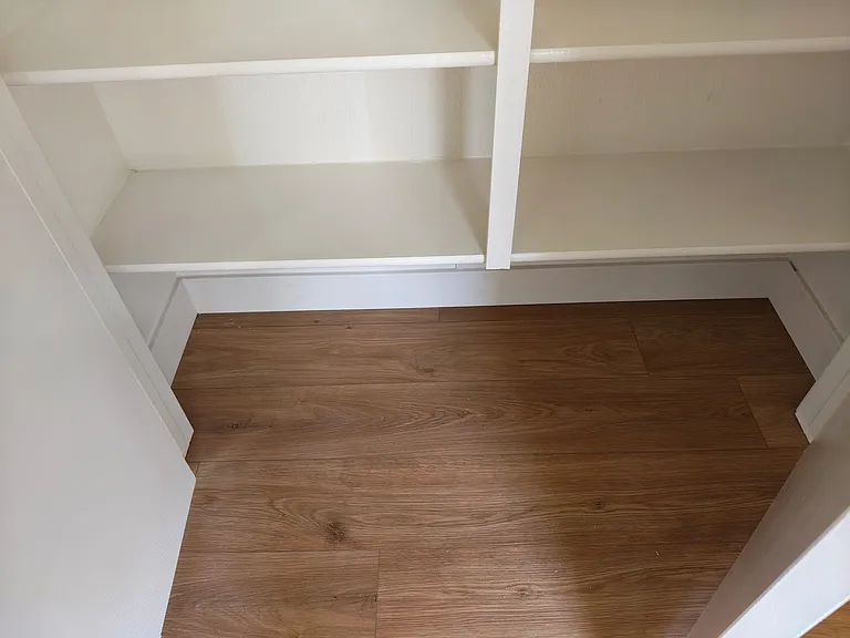 Kitchen Pantry (partial pic) showing flooring and two bottom shelves