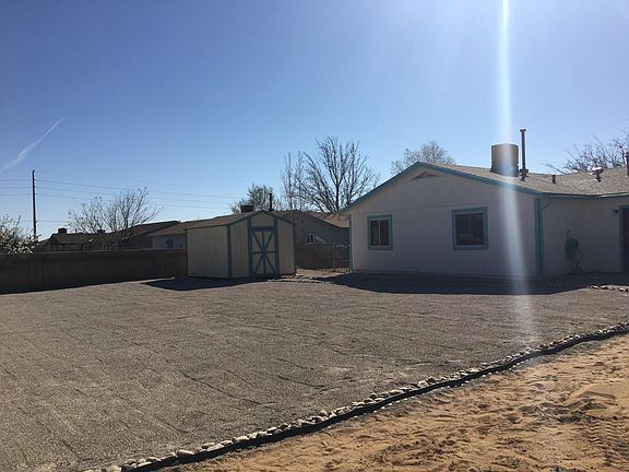 Xeriscaped back yard with room for a garden.