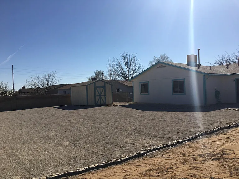Xeriscaped back yard with room for a garden.