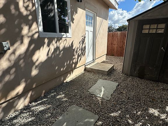 Entry, Storage Shed, and Avocado Tree