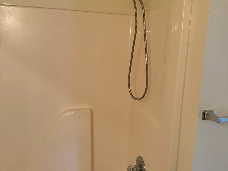 Both shower tubs have a shower rod and a 6-foot removal shower head. Makes for easy cleaning.