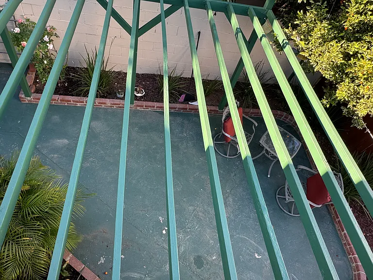 Shaded patio can be seen from primary suite rooftop patio.
