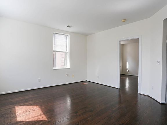 Sun-Filled Living Room with Dark Wood Flooring
