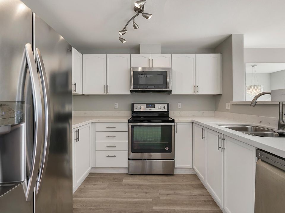 Kitchen with Quartz countertops and stainless steel appliances