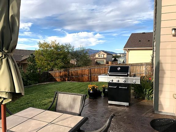 Back patio with beautiful view of Pikes Peak