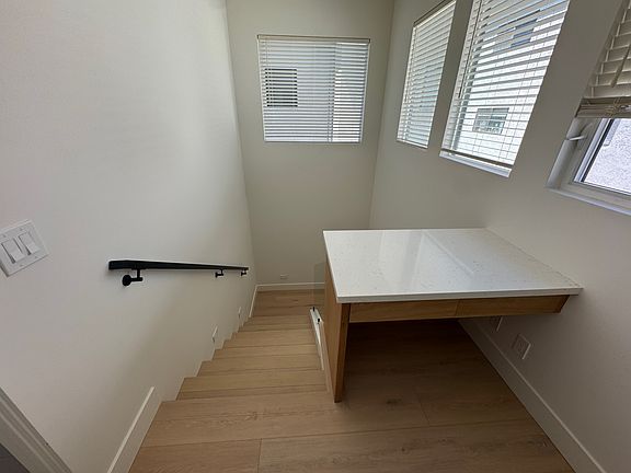 Built-in desk at the top of the stairs