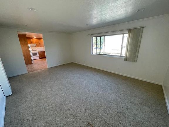 Photo from living room with view into kitchen