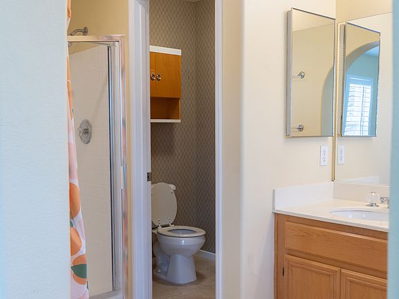 Separate toilet with door.