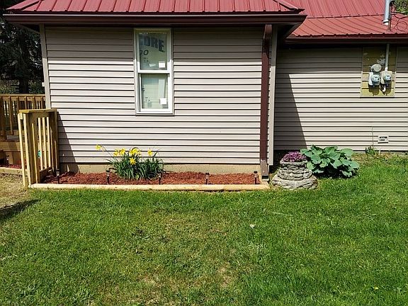 side house new window, siding, landscape