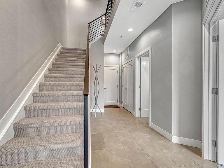 Entry level with bedroom, full bathroom, walk-in closet and oversized 2-car garage
